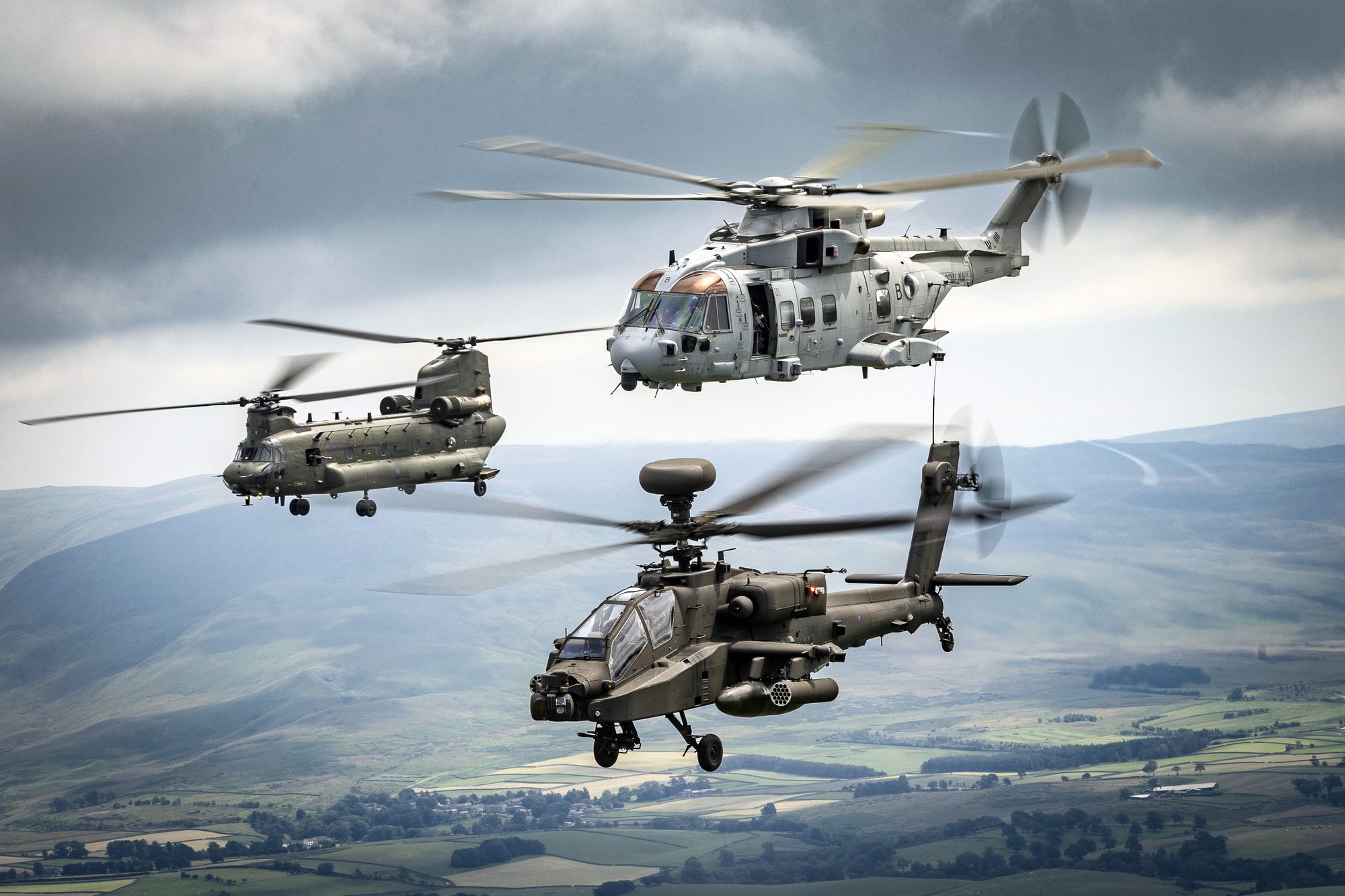 RAF Chinook, Wildcat and Apache helicopters in formation over the UK.